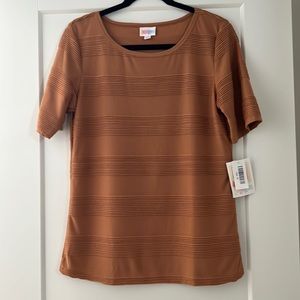 NEW w/tags LuLaRoe Gigi top in a goldenrod color. Gorgeous pleating. Size Medium